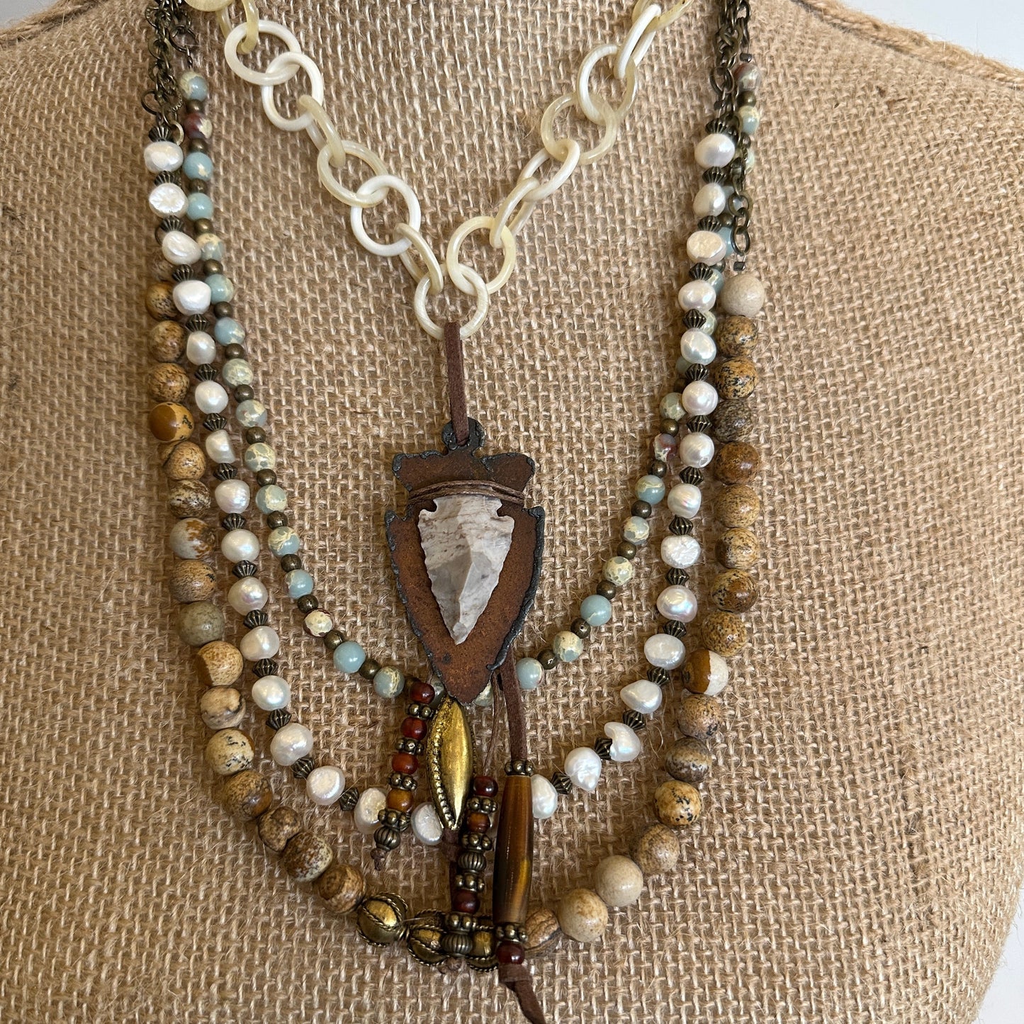 Layered beaded necklaces with pendant