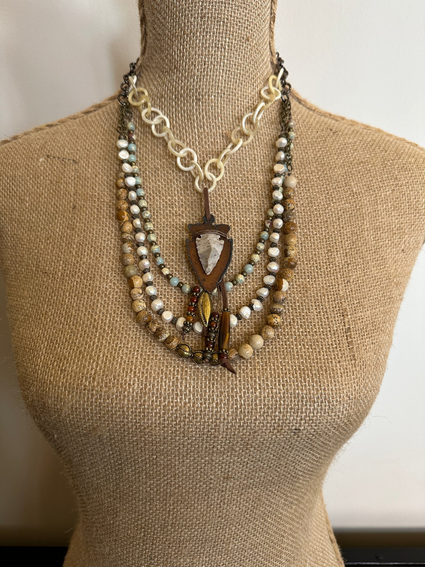 Necklaces on a mannequin.
