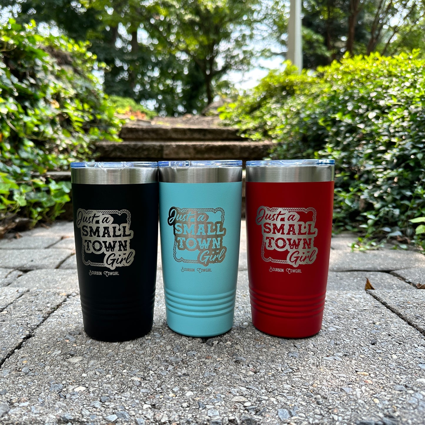 Three travel mugs with Small Town Girl text.
