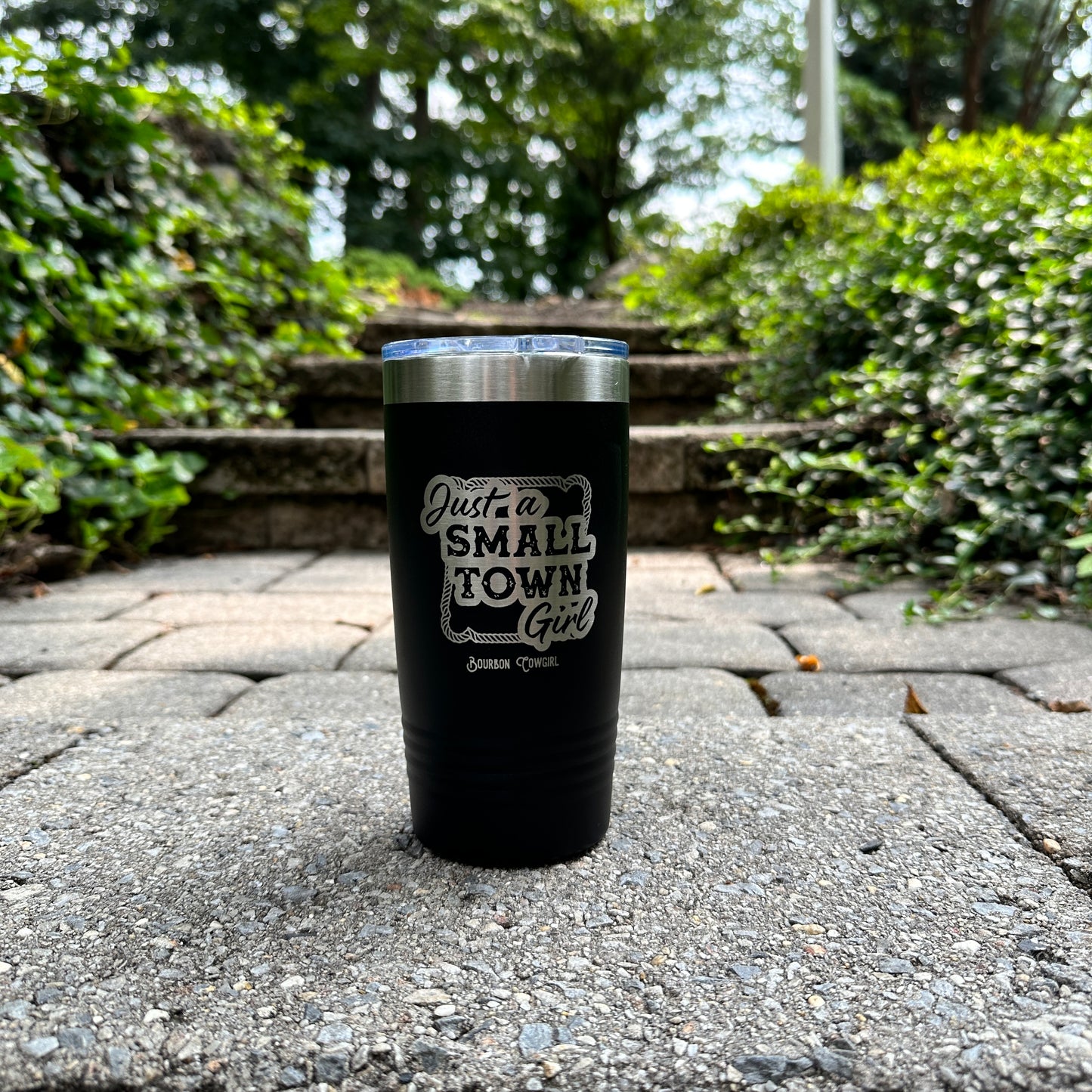 Black tumbler with Just a Small Town Girl text.