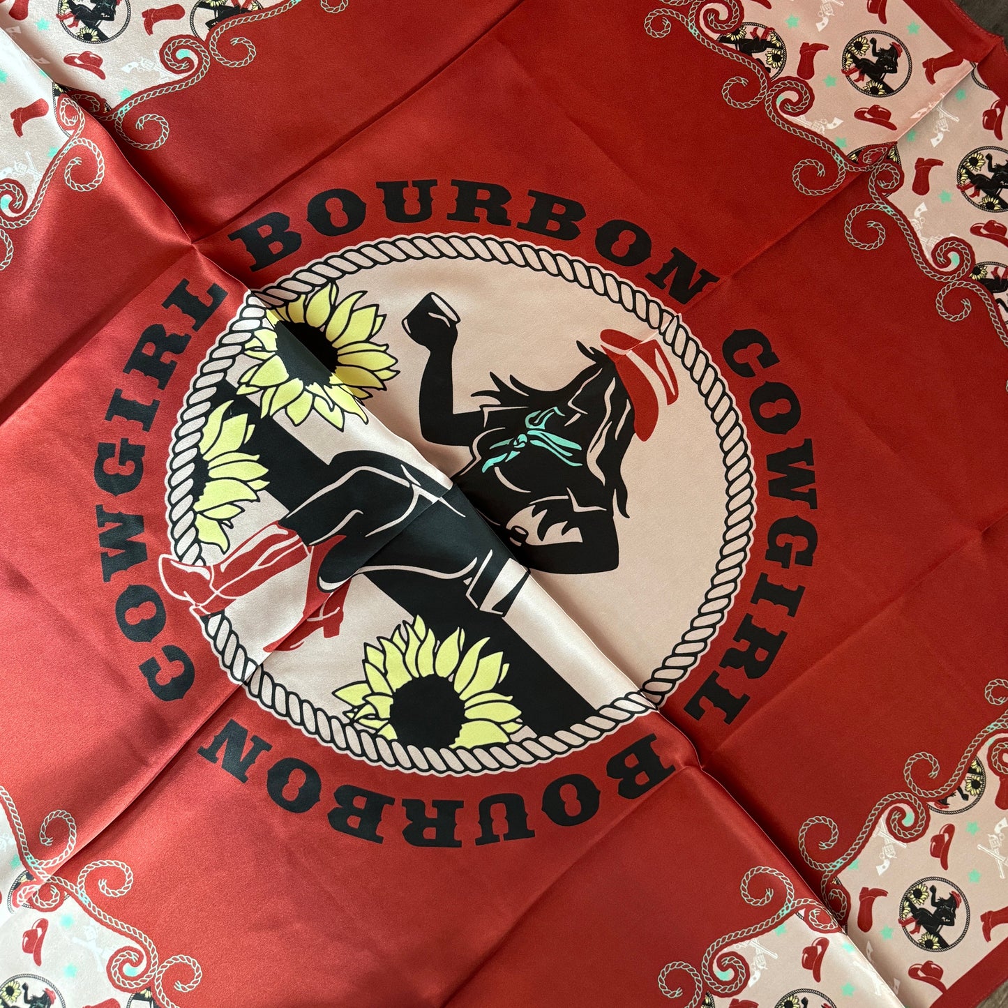 Red bandana with cowgirl graphic.