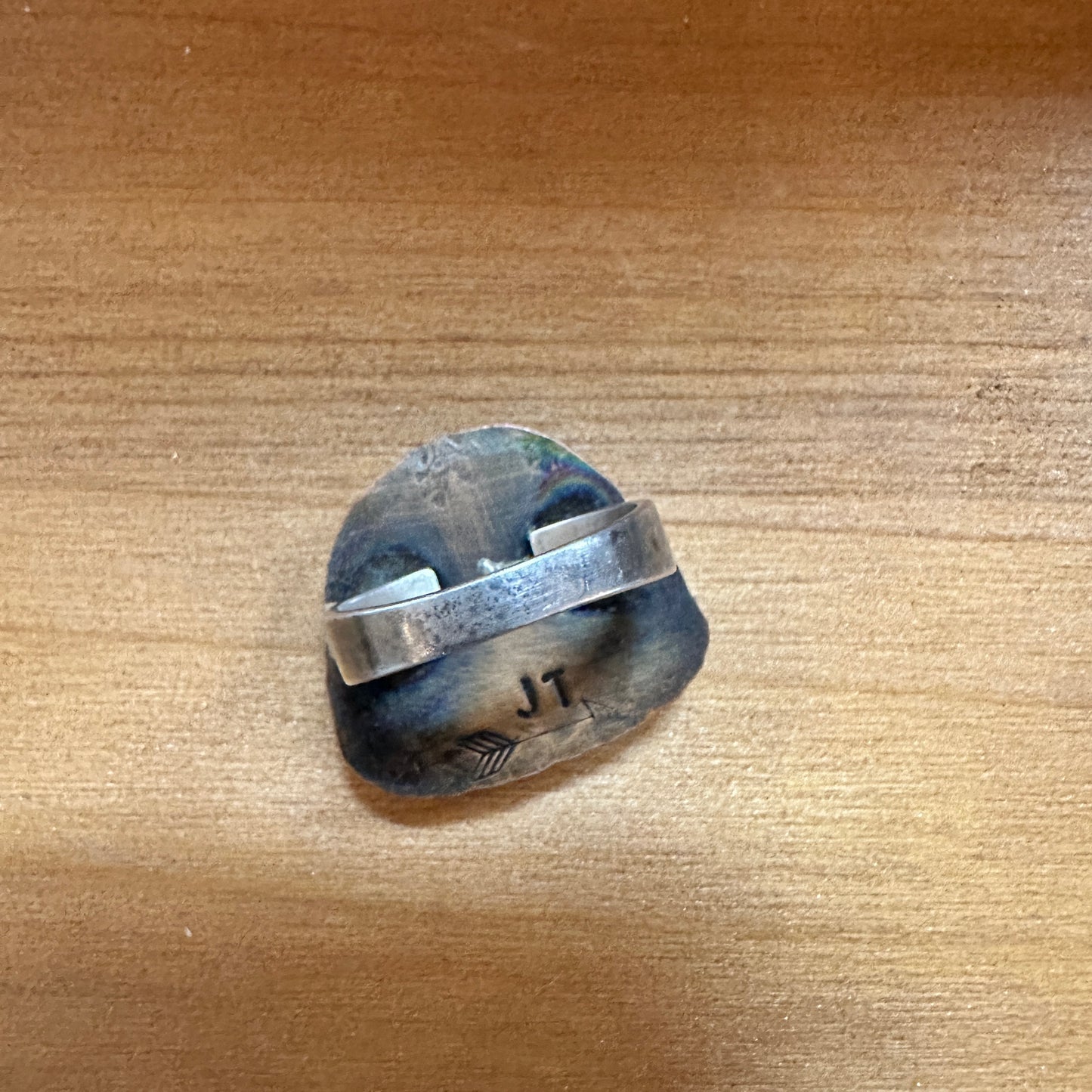 Ring with silver band and stone, engraved with JT.