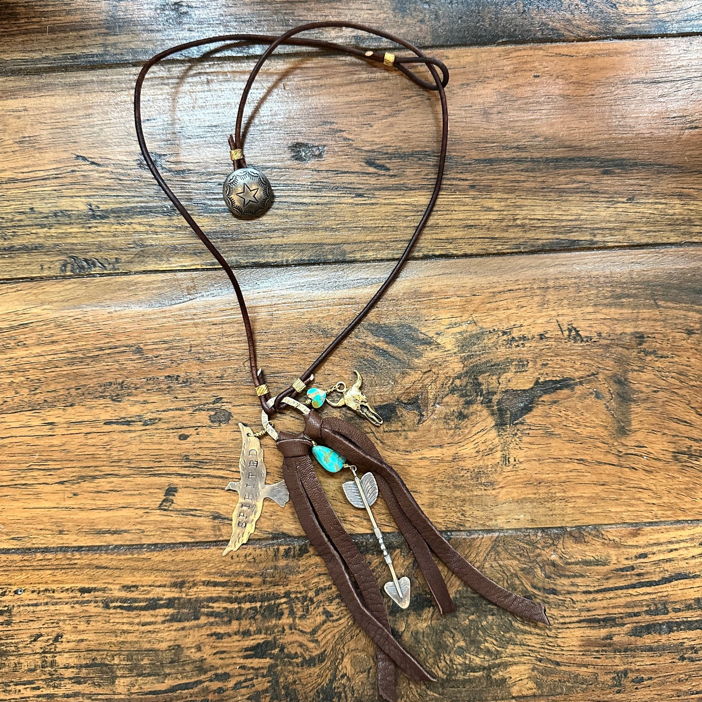 Leather necklace with charms.
