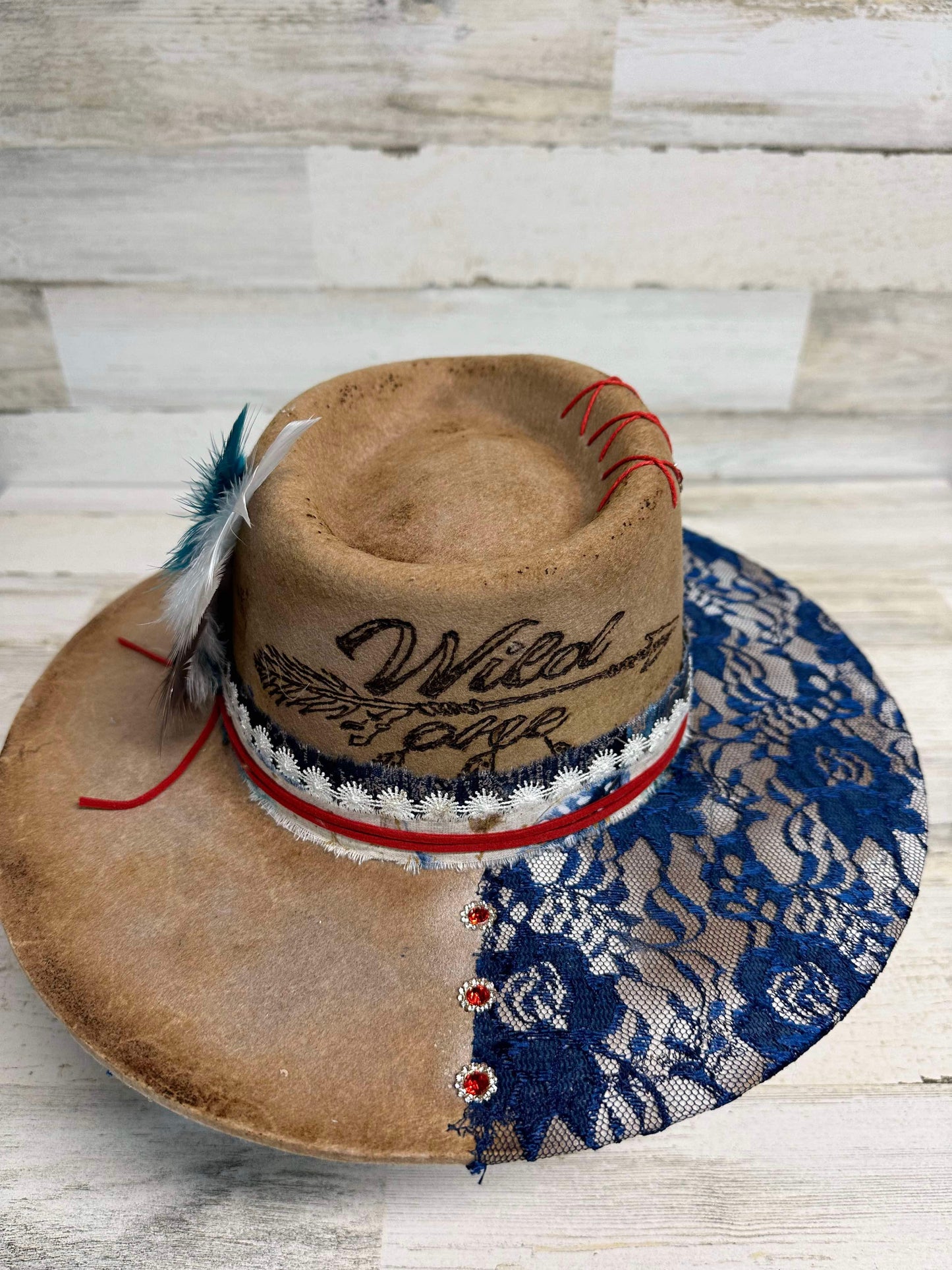 Tan hat with blue lace brim