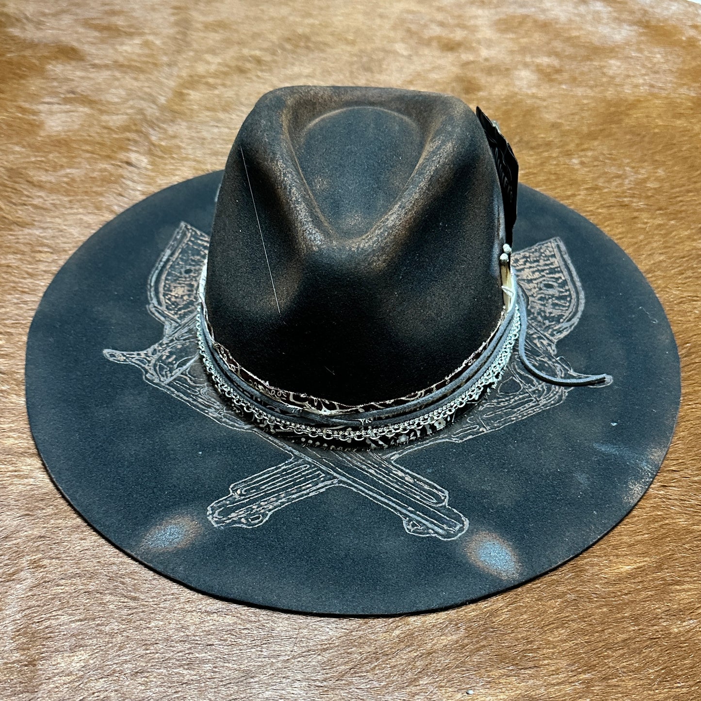 Dark fedora hat with decorative brim.