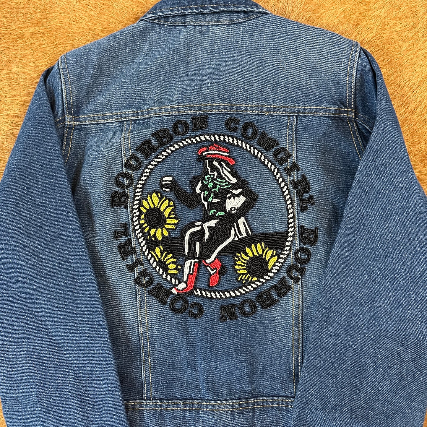 Denim jacket with Bourbon Cowgirl patch.