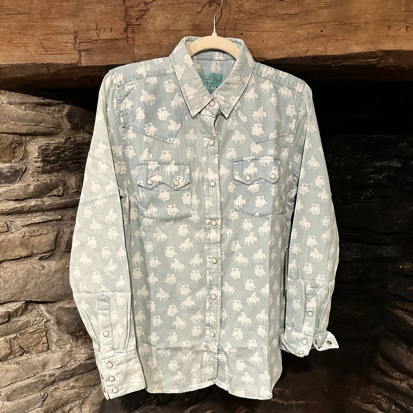 Light blue shirt with white horse pattern.