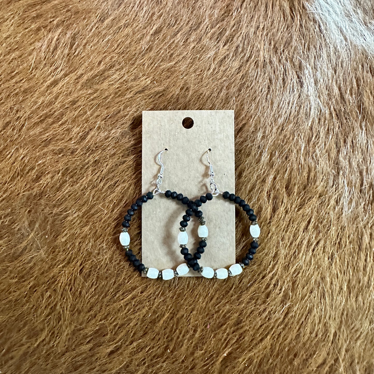 Hoop earrings with black and white beads.