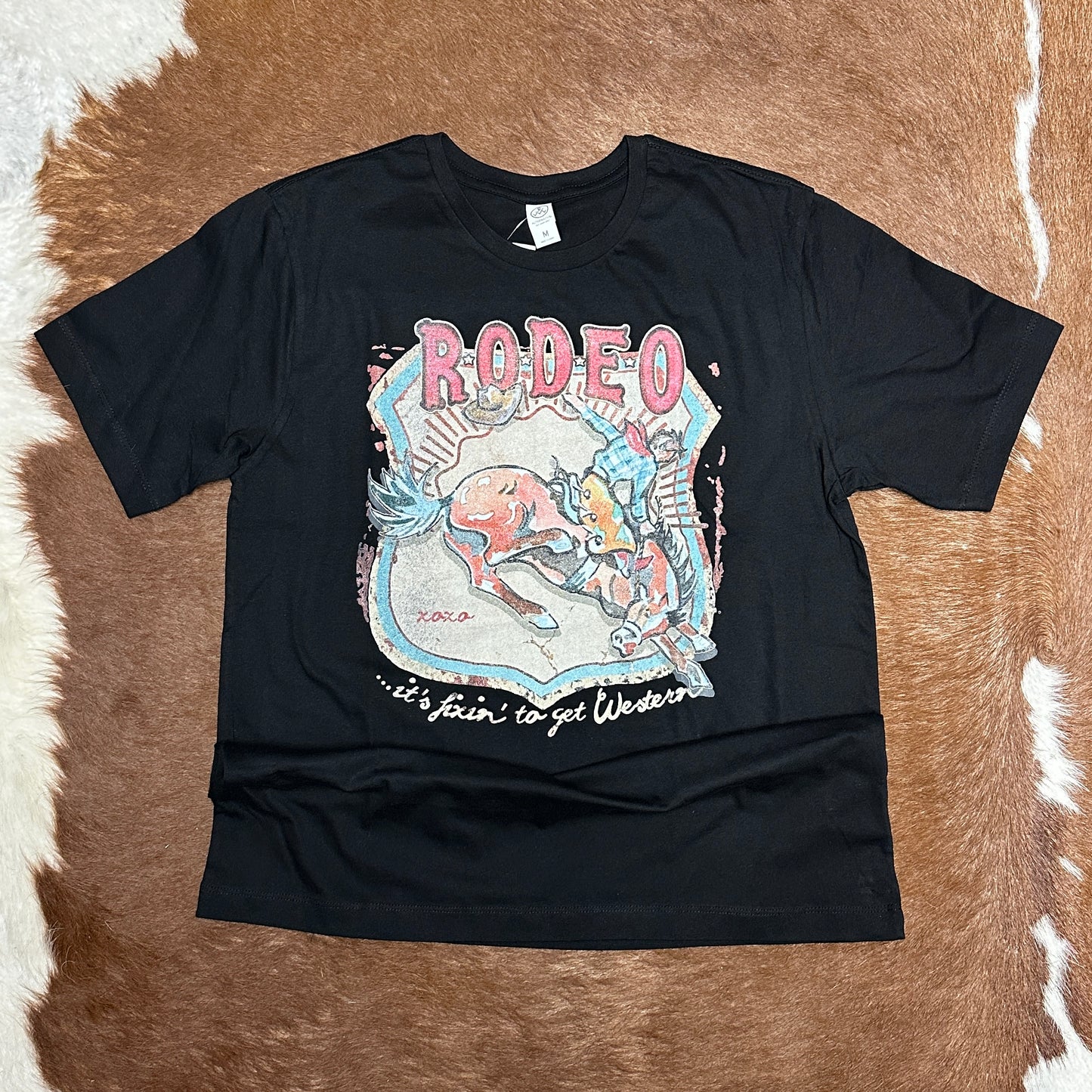 Black t-shirt with rodeo graphic.
