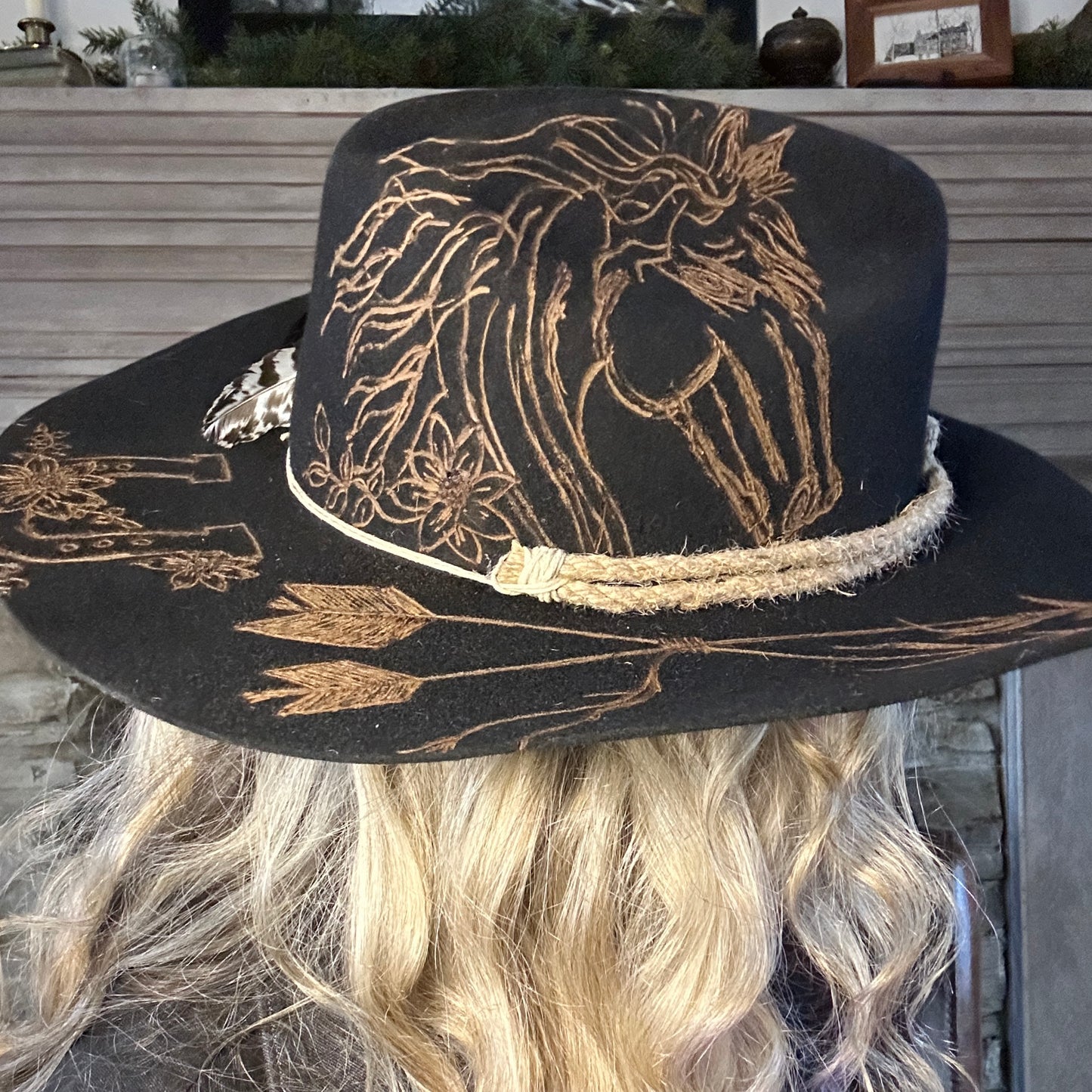 Black cowboy hat with horse design.