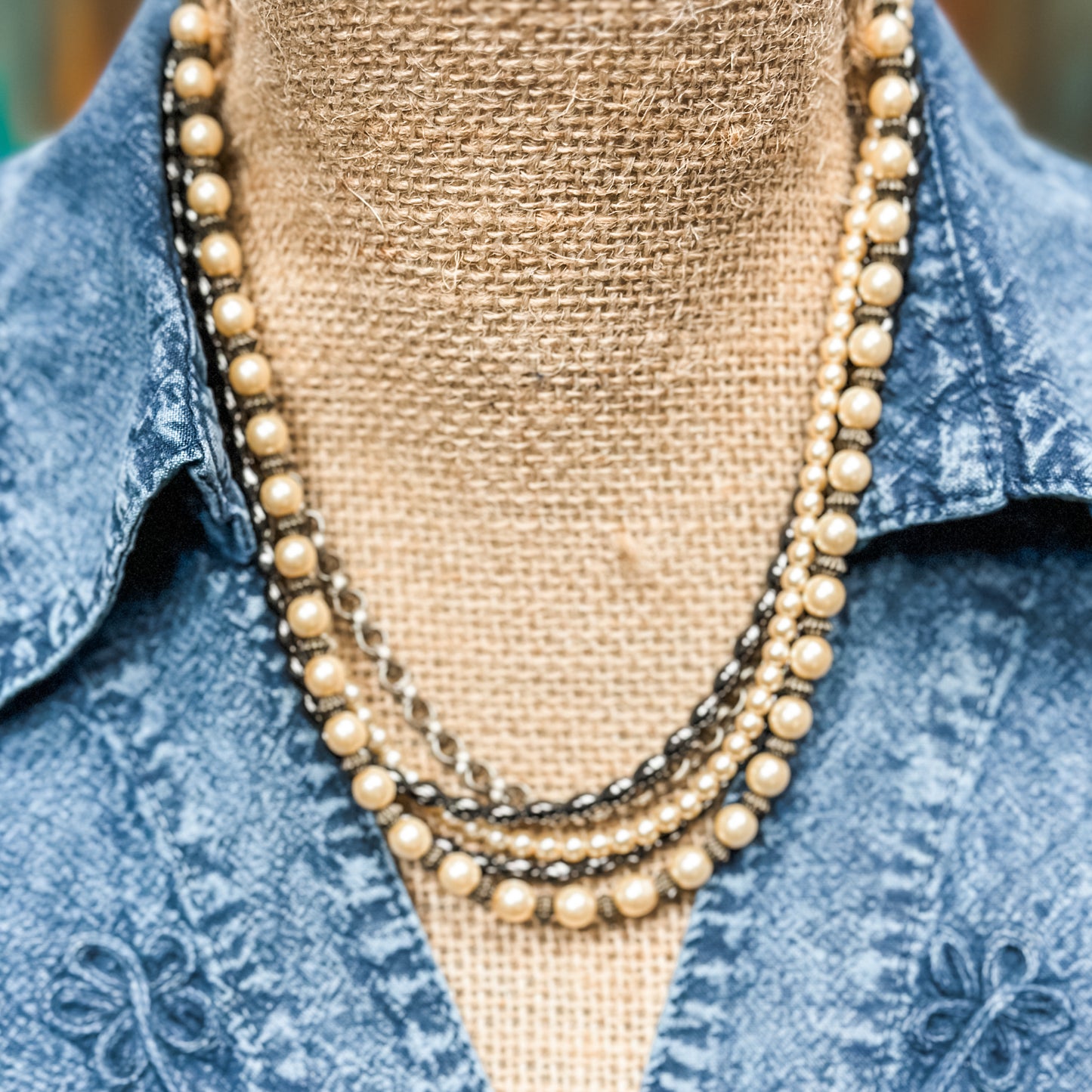 Vintage layered pearl necklace on display