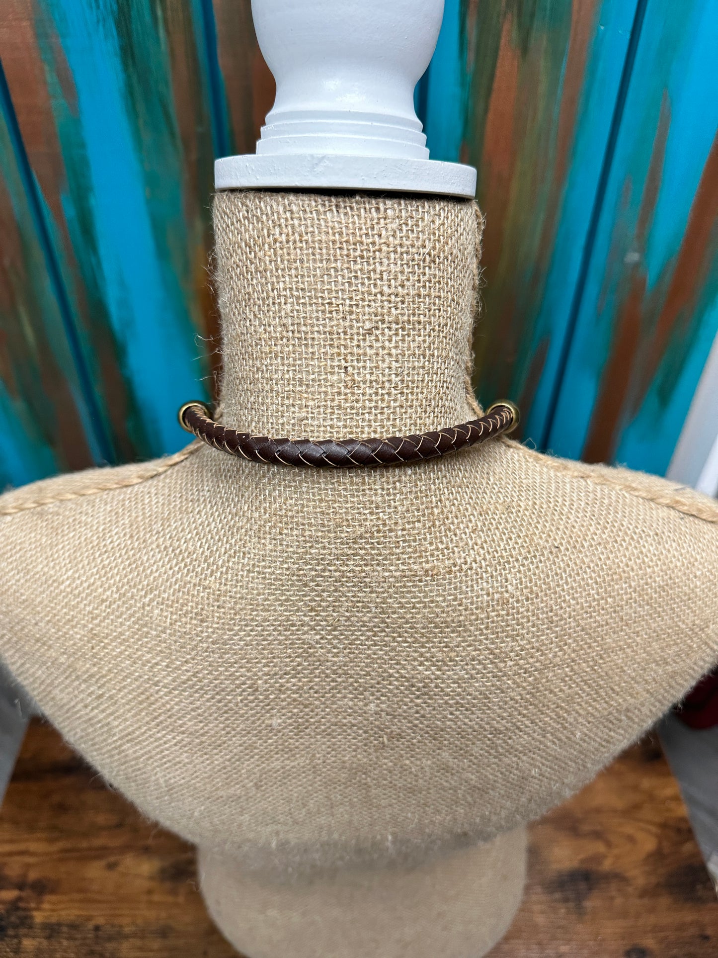 Necklace on a mannequin neck.