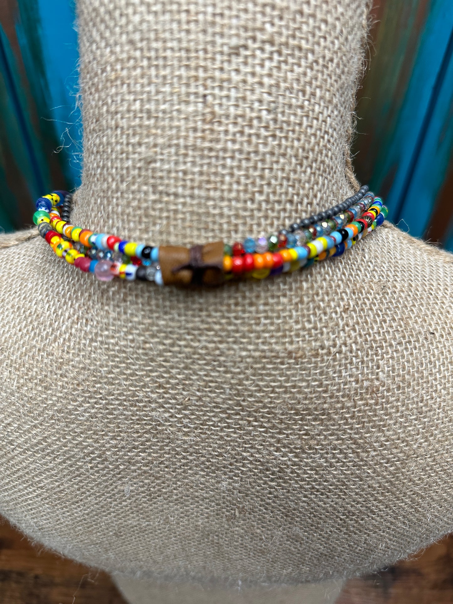 Beaded necklace on a mannequin.