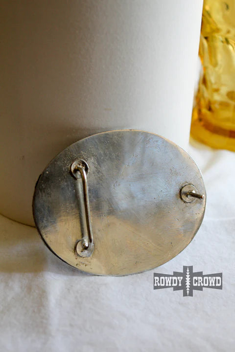 Back of oval silver belt buckle