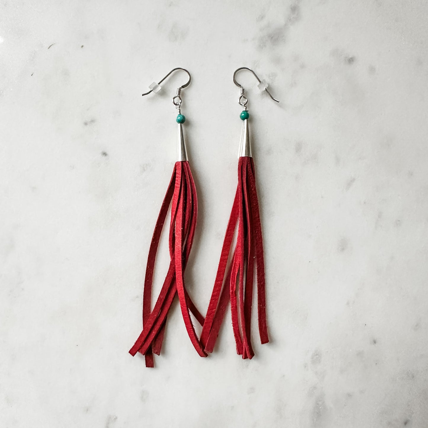 Red leather tassel earrings.