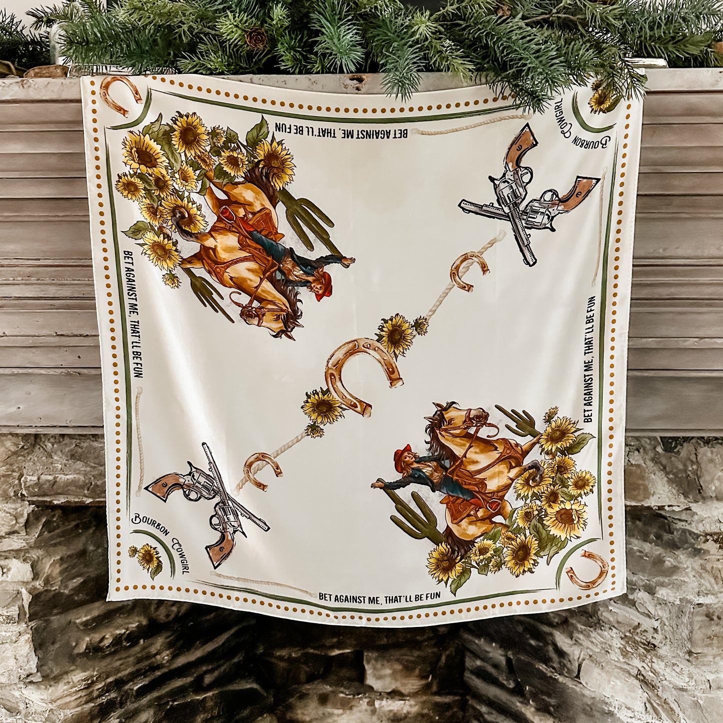 Cowboy-themed scarf with horses, guns, and sunflowers.