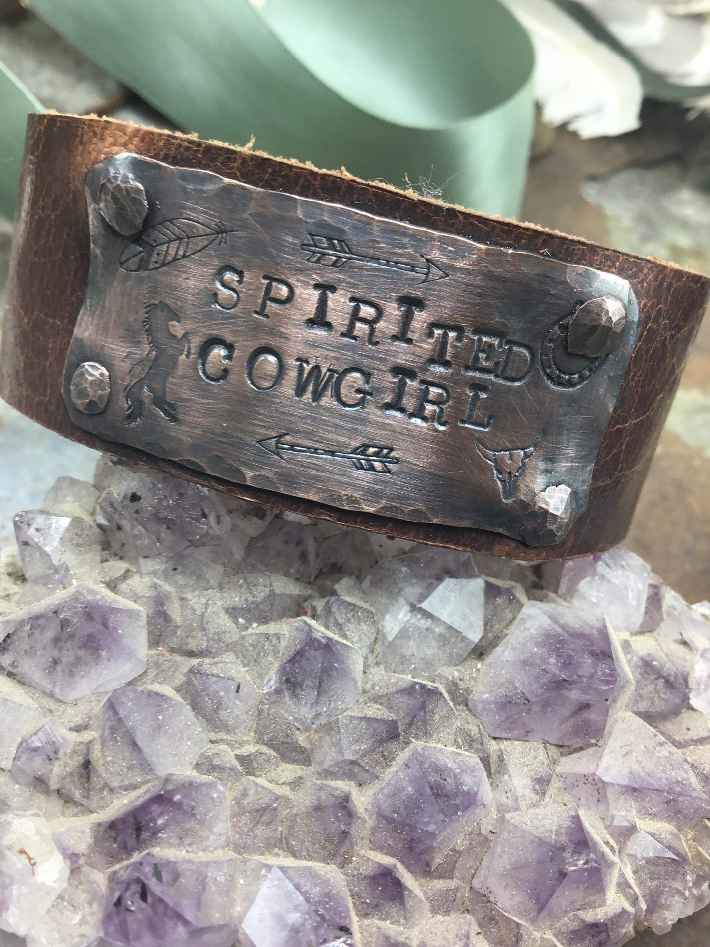 Leather bracelet with Spirited Cowgirl on amethyst.
