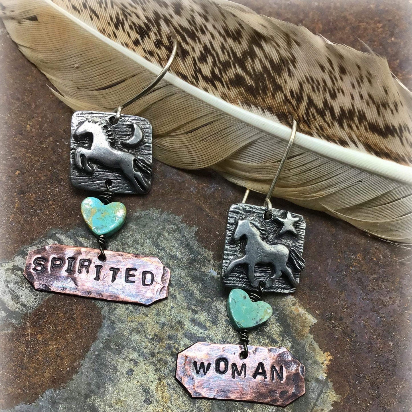 Earrings with horses, hearts, and words.