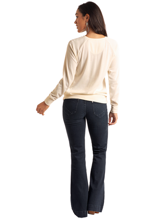 woman in jeans and cream top