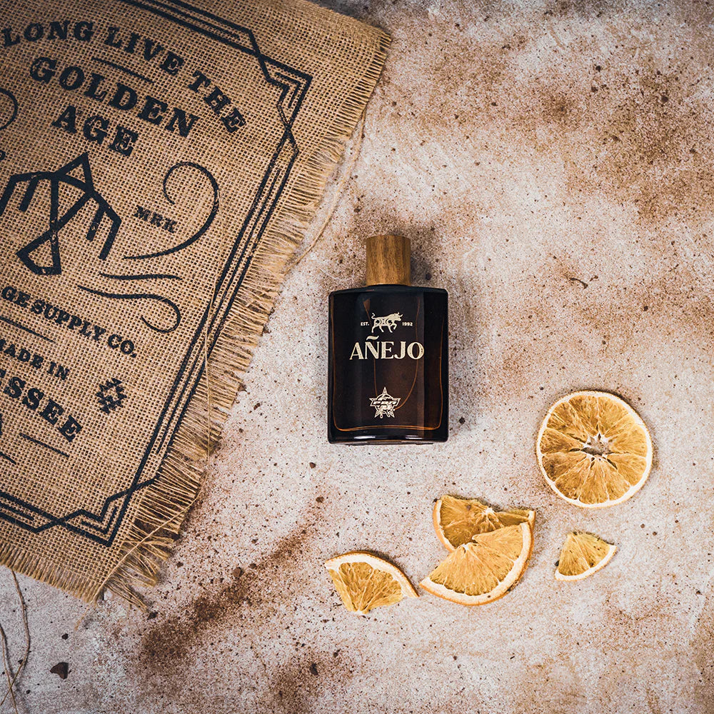 Anejo cologne lifestyle shot with orange slices