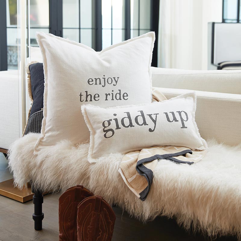 Enjoy the ride & Giddy Up pillows on fur bench