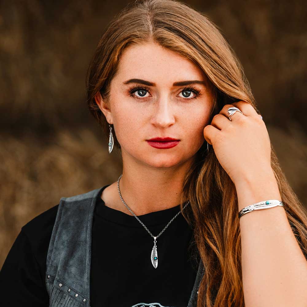 Woman wearing feather jewelry