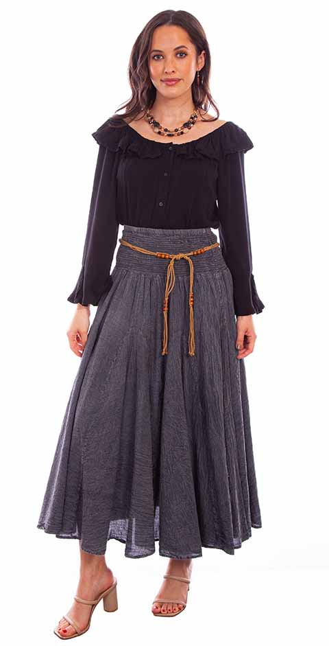 Woman in black blouse and gray skirt
