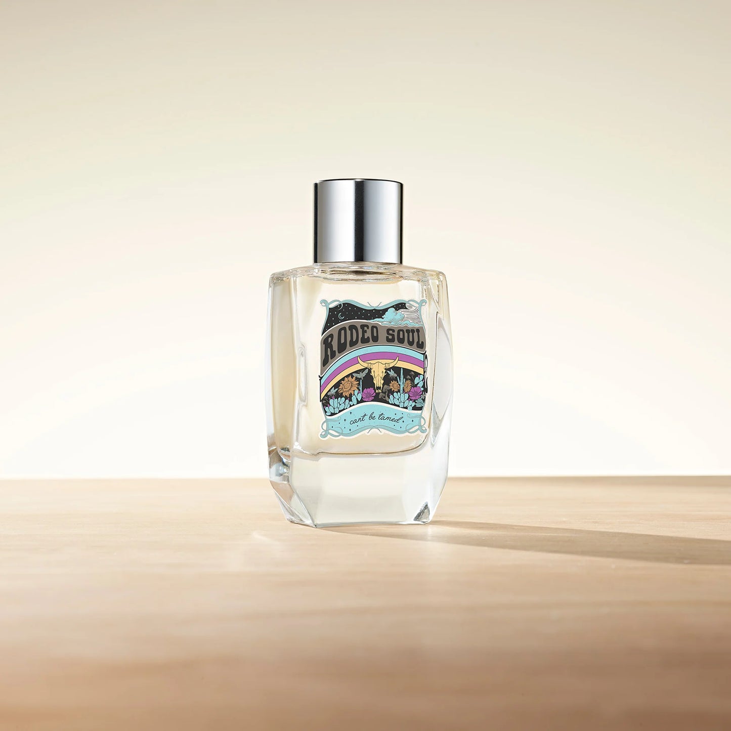 Rodeo Soul perfume bottle on wooden surface