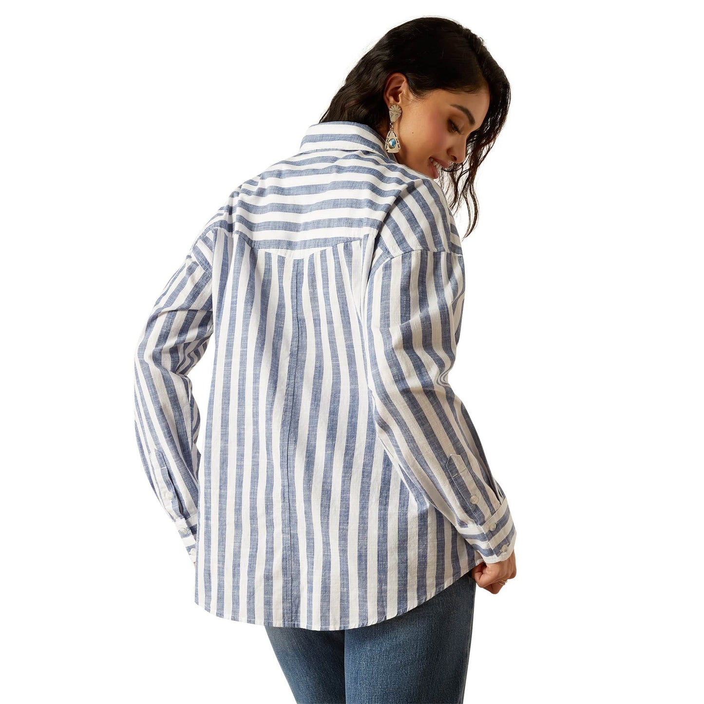 Woman wearing striped blue and white shirt, back view