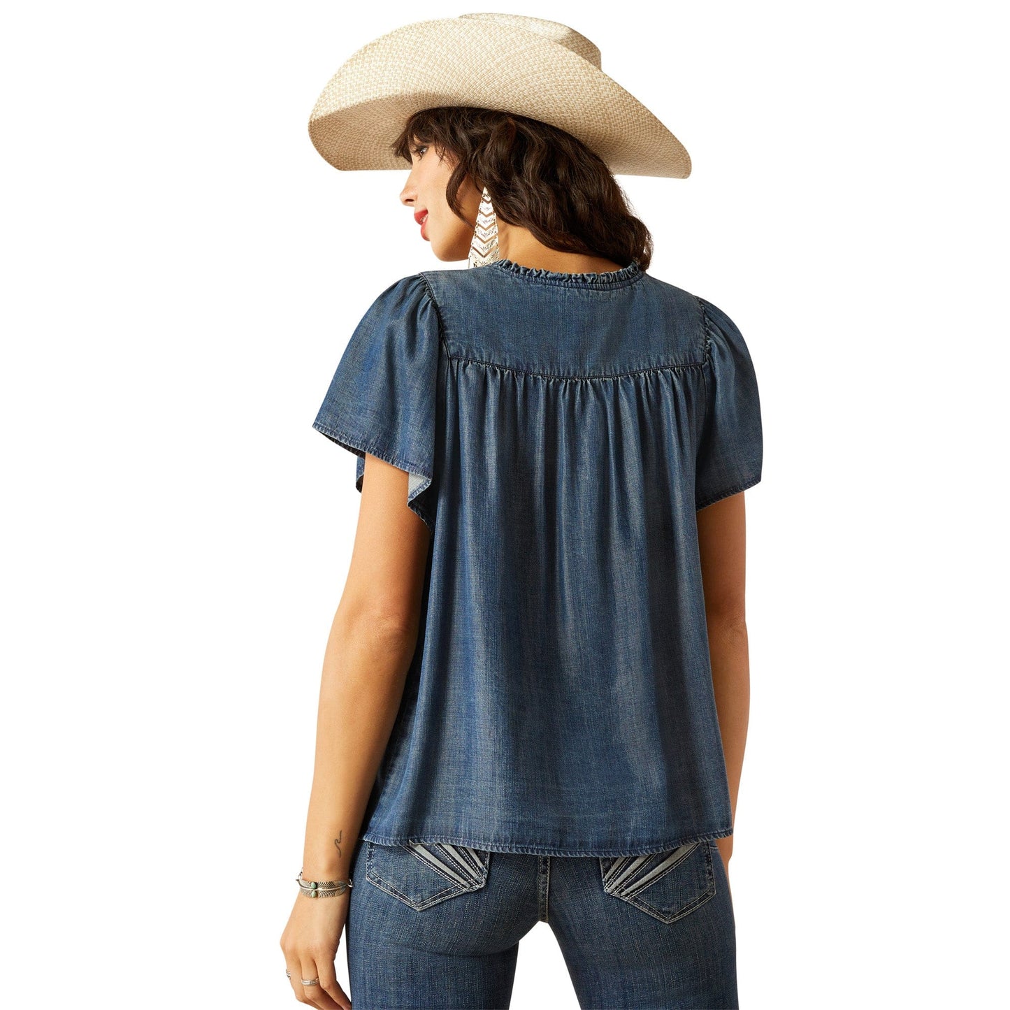 Woman in denim top, S25_WMS_WEST_10055137 back view