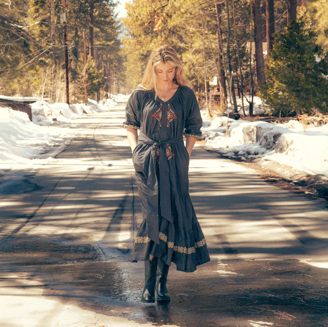 Mariana Dress in Onyx Gray - woman on road in winter