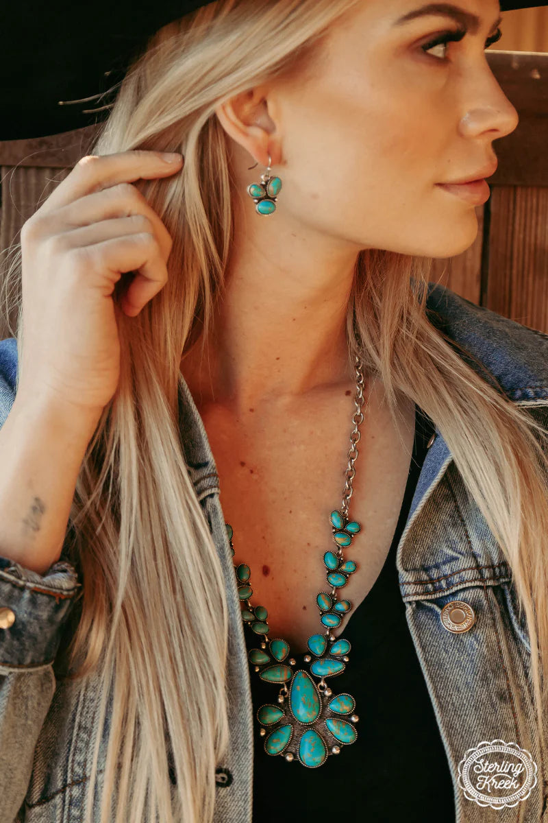 Woman wearing Stagecoach turquoise jewelry