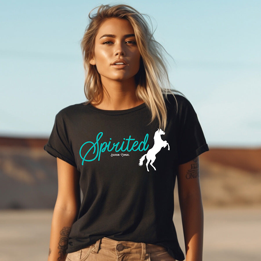 Woman in Spirited shirt with horse graphic