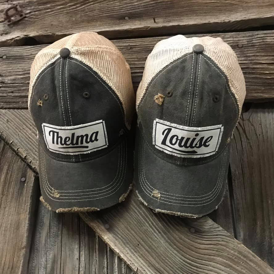 Thelma and Louise hats on wood