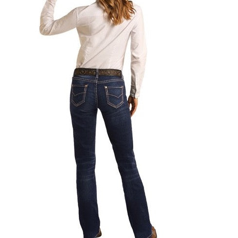 Woman in dark denim jeans and white shirt