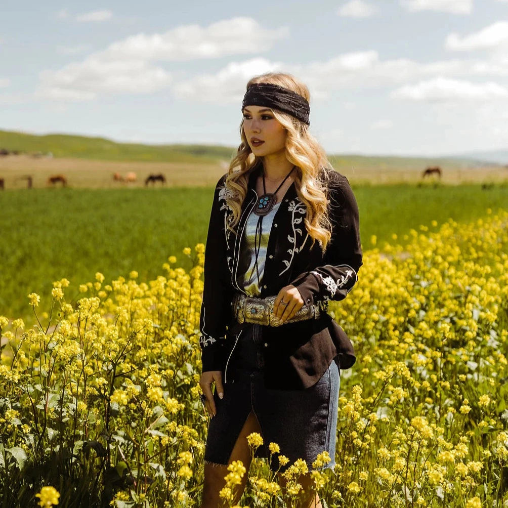 Woman in field of wildflowers, Western style