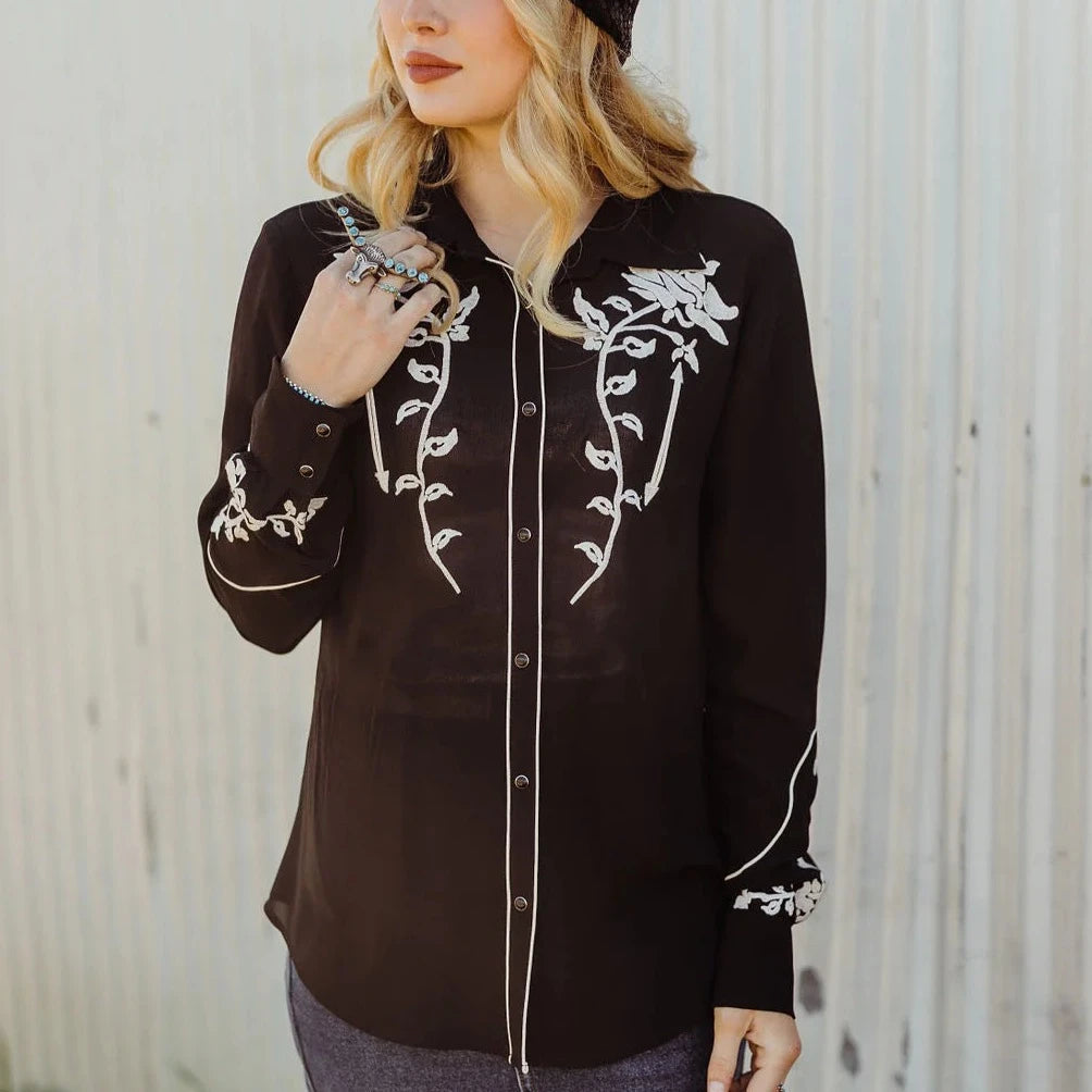Woman in Western wildflower embroidered shirt