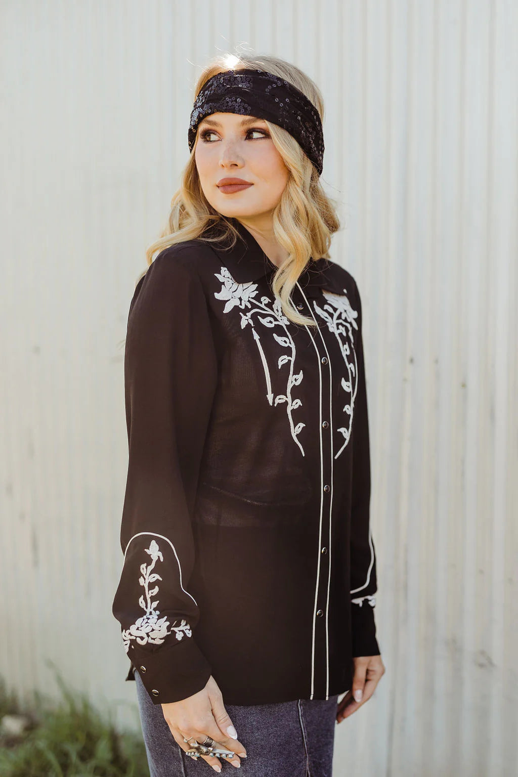 Woman in black floral Western shirt