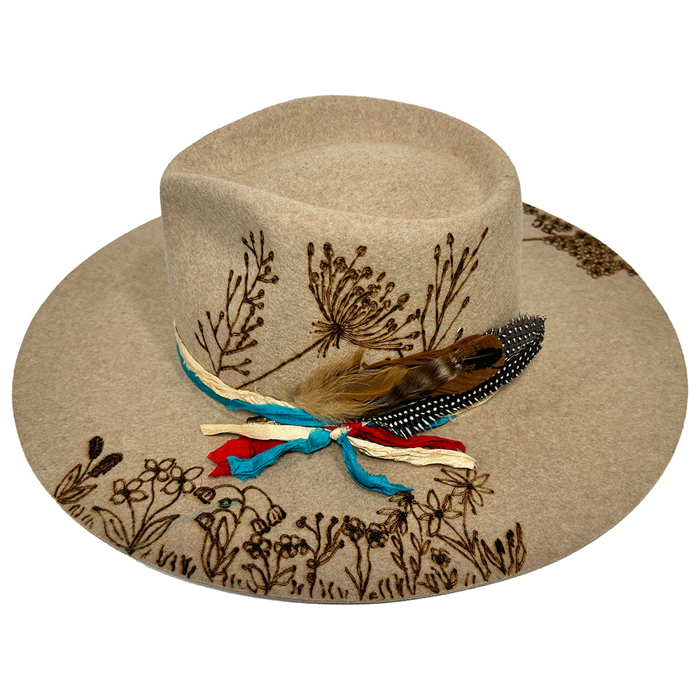 Tan Western hat with floral embroidery and feathers