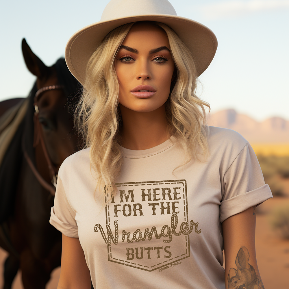 Woman in I'm Here for the Wrangler Butts tee with horse