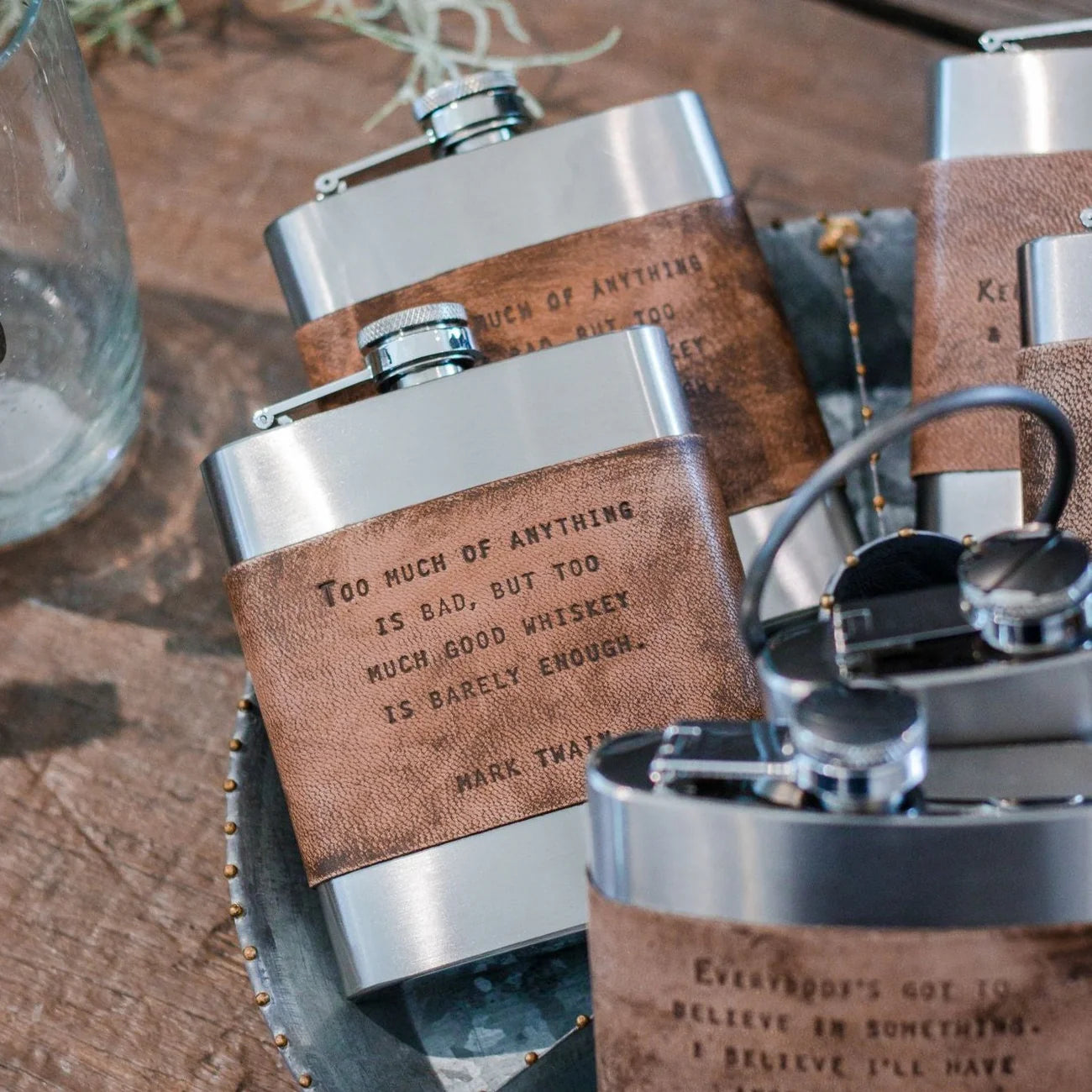 Whiskey flasks with Mark Twain quote