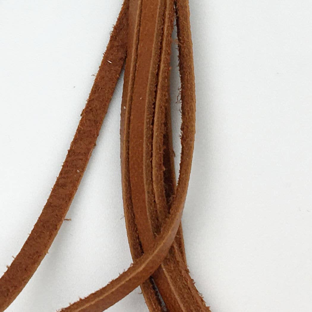 Brown leather strips against a white background.