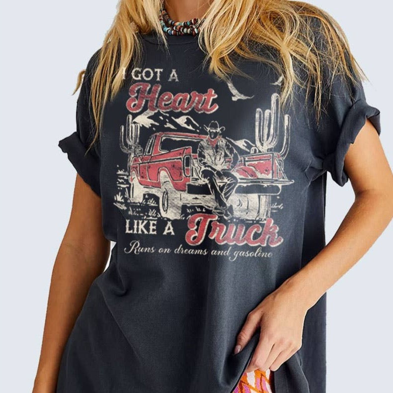 Woman wearing a black graphic t-shirt.