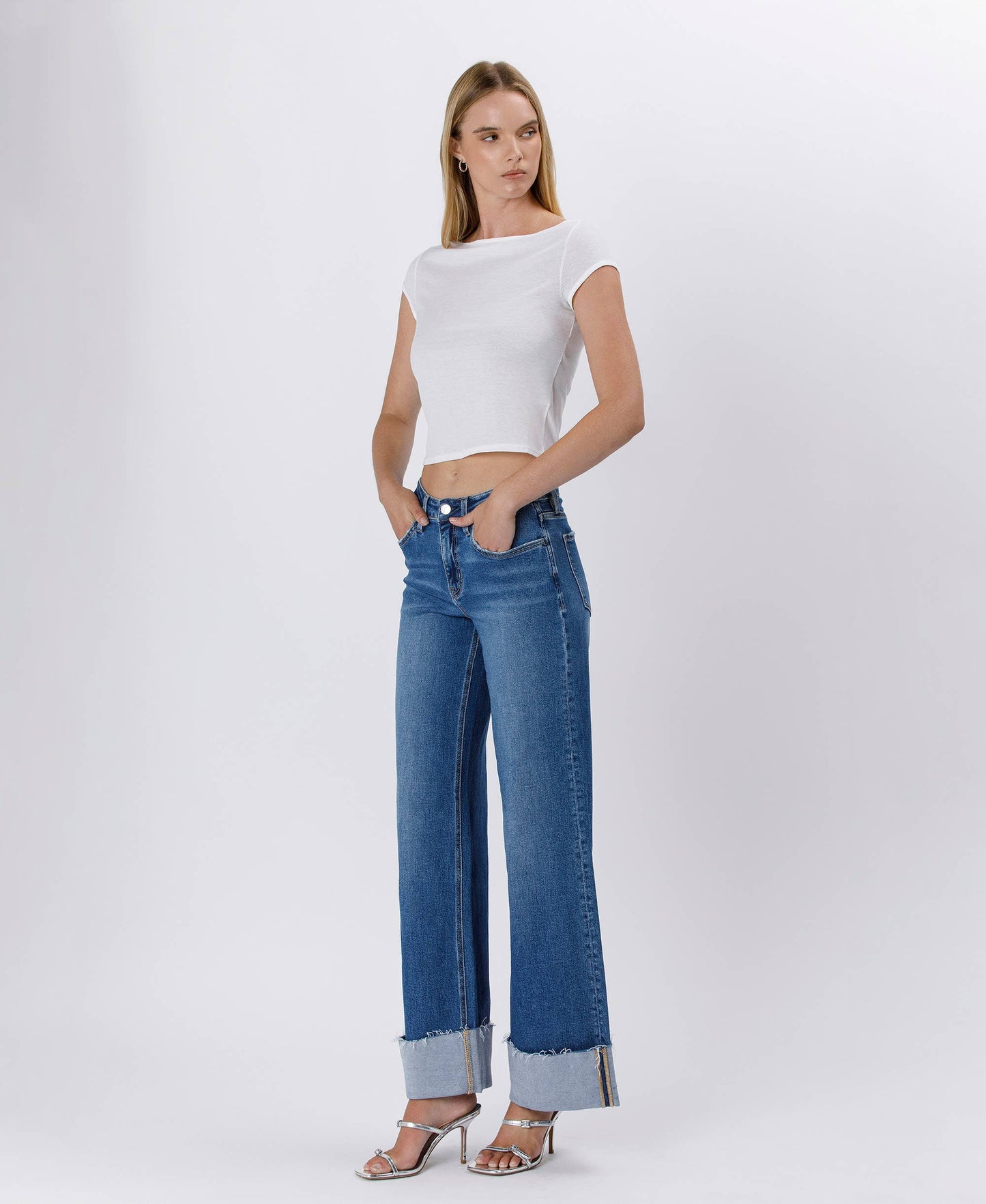 Woman in white top and blue jeans