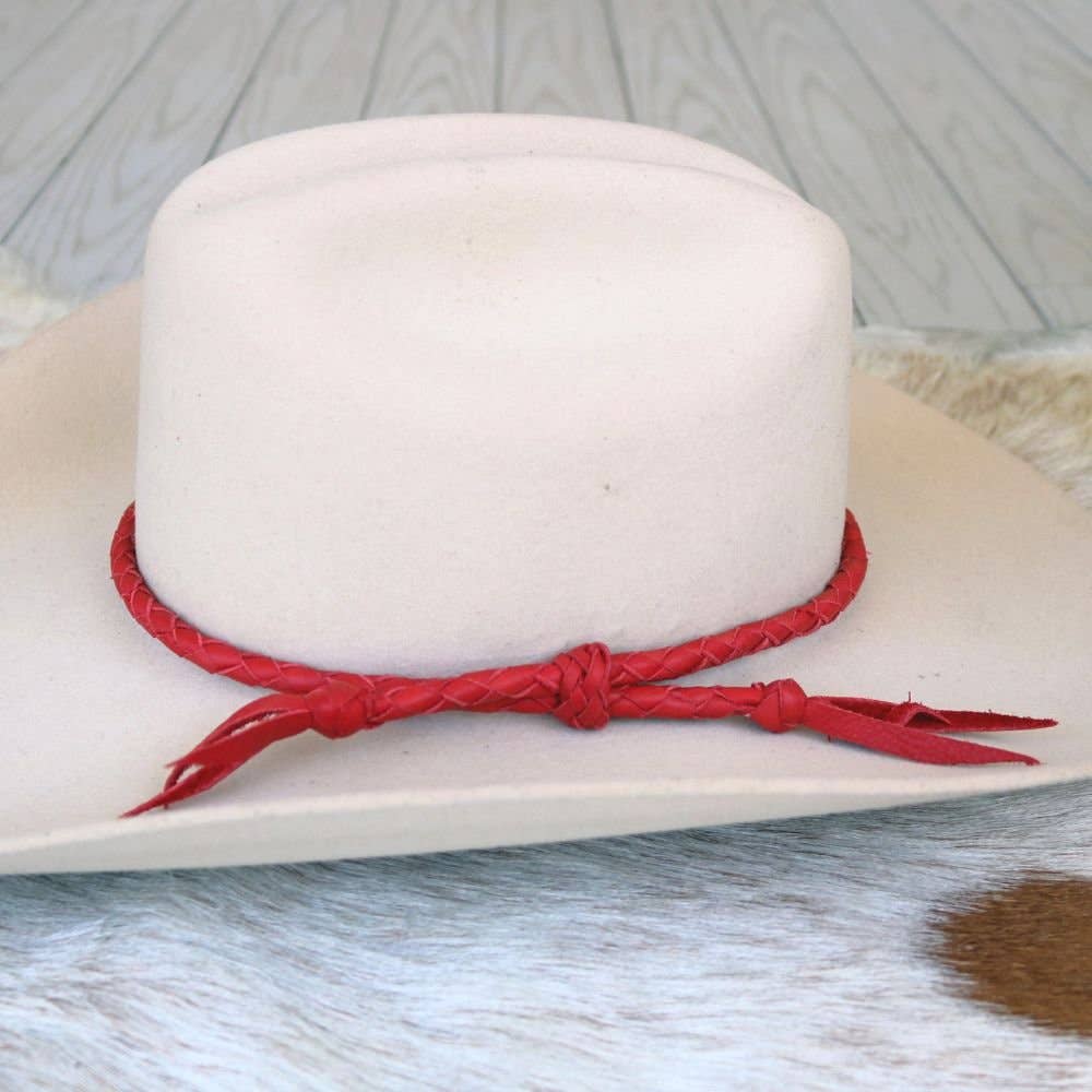 Cowboy hat with red band.