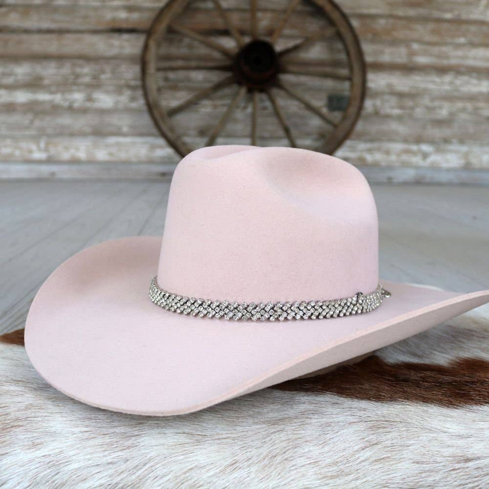 Pink cowboy hat with jeweled band.