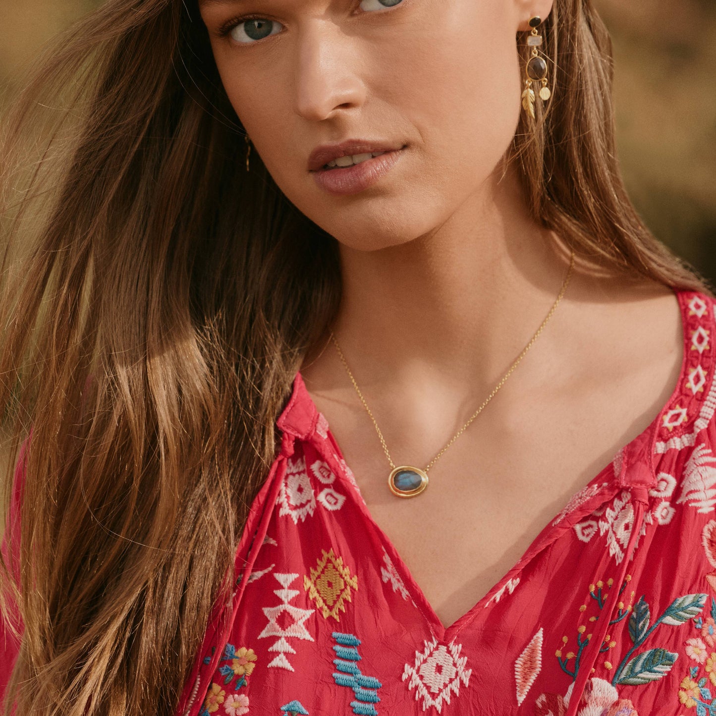 Red catalog necklace on woman