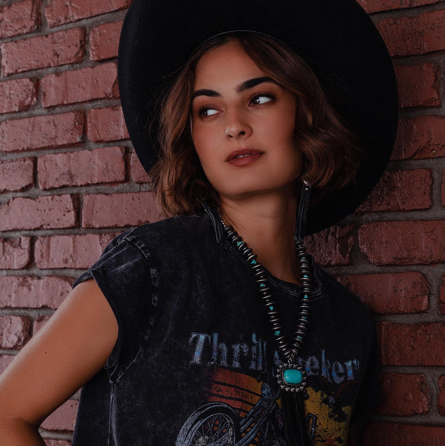Woman in hat and necklace, lifestyle image