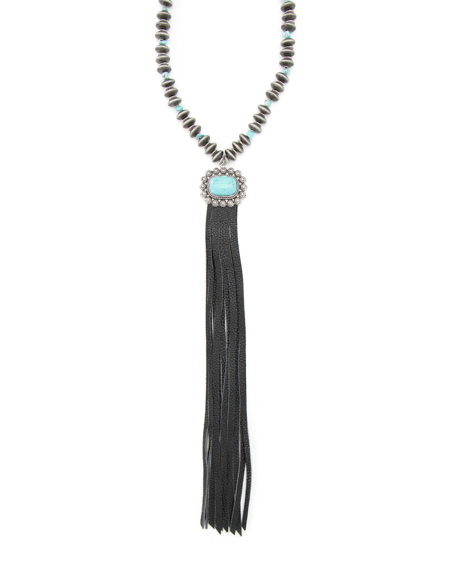 Close-up of beaded necklace with turquoise pendant and black tassel.
