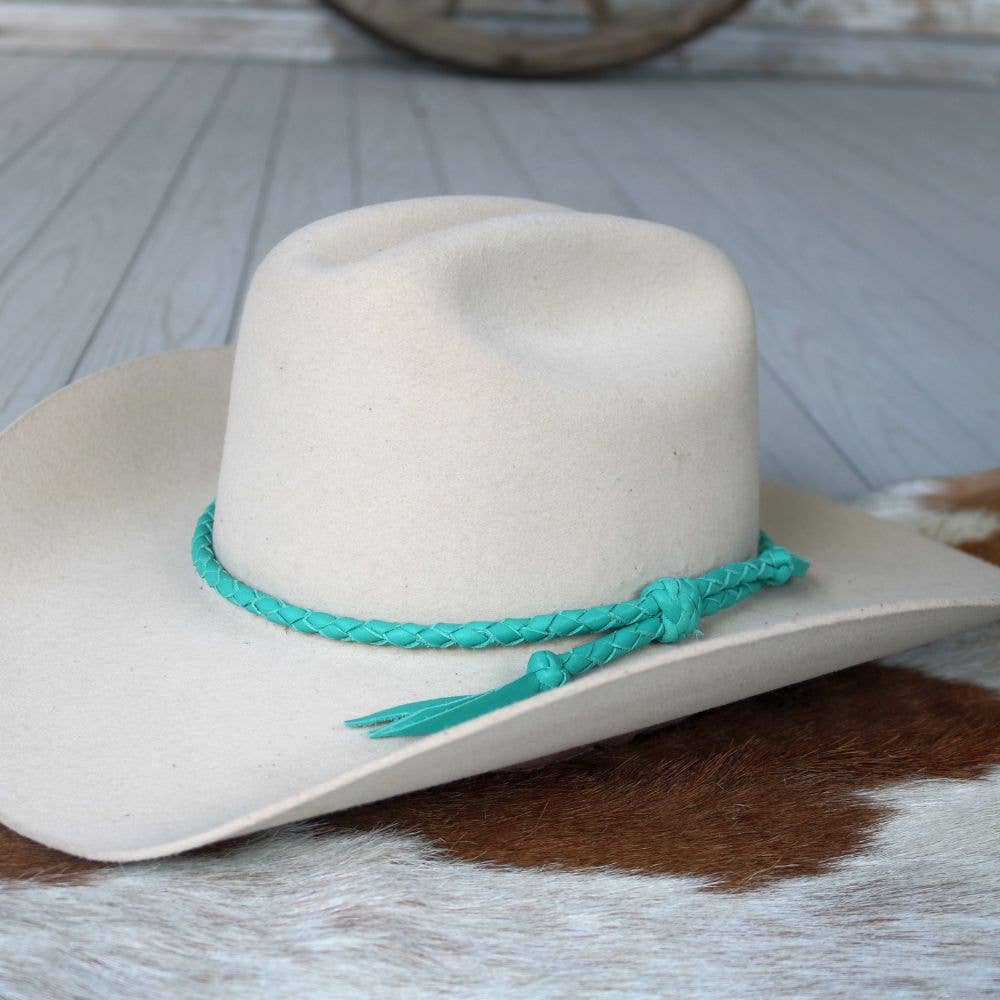 Cowboy hat with turquoise hatband.
